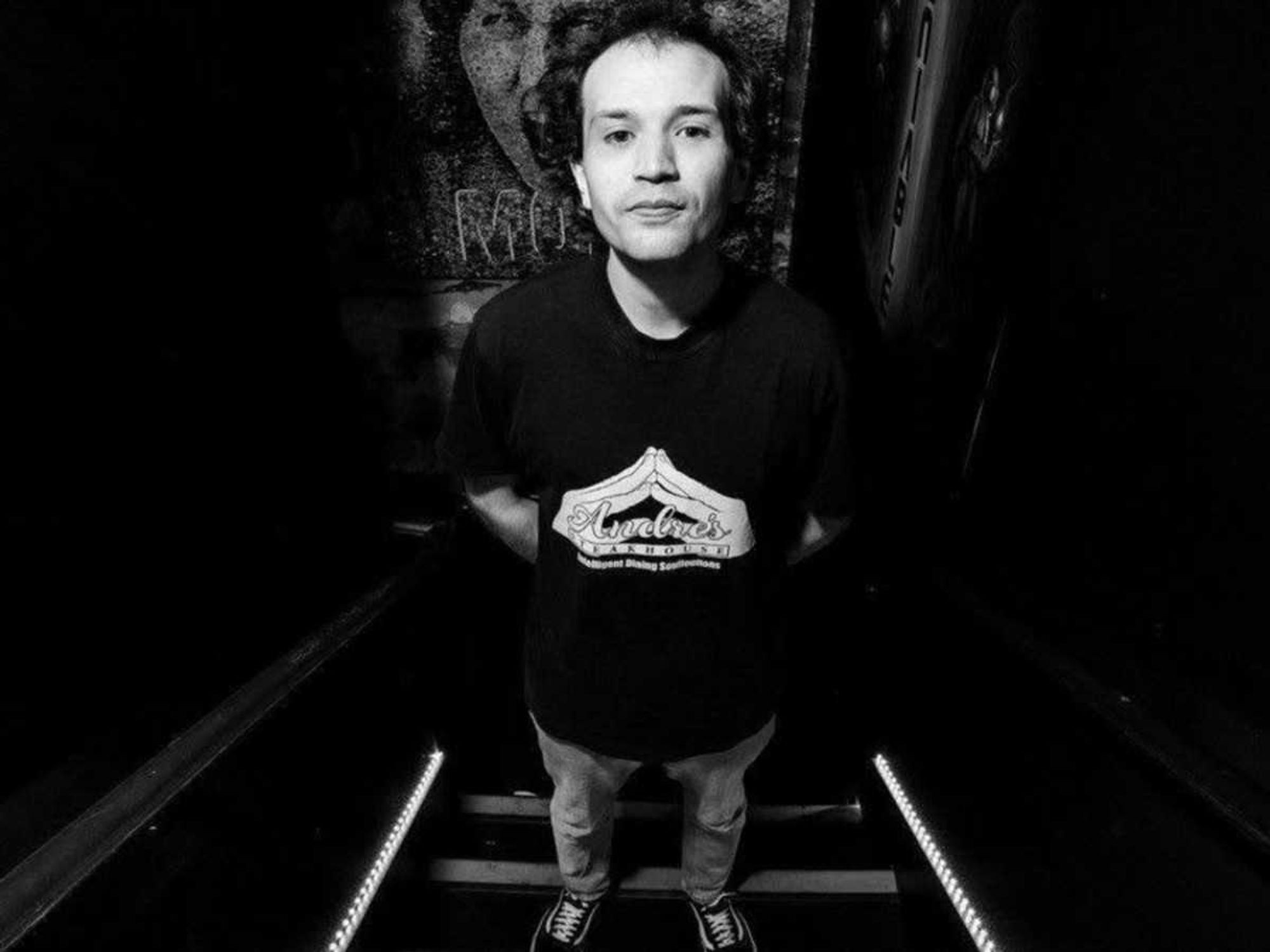 Black and white portrait of comedian Pat O’Neill in a stairwell